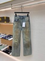 Acne Studios dirty, ink splattered, ripped jeans