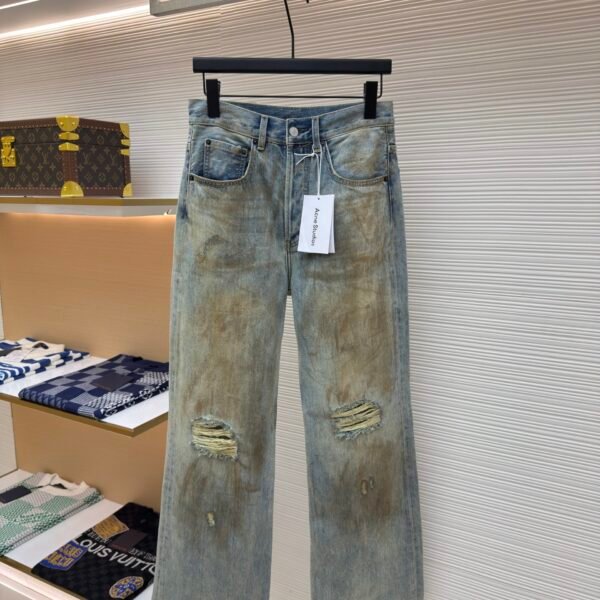 Acne Studios dirty, ink splattered, ripped jeans