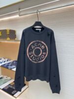 Acne Studios breaks hole to make old logo sweatshirt