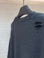 Acne Studios breaks hole to make old logo sweatshirt - Image 9