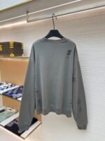 Acne Studios breaks hole to make old logo sweatshirt - Image 2