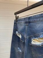 Balenciaga destroys denim wide leg pants - Image 9