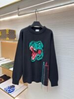 Charlie Luciano dinosaur head sweater