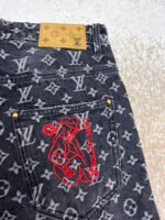 Louis Vuitton Limited Edition Distressed Jacquard Little Red Man Embroidered Jeans - Image 11